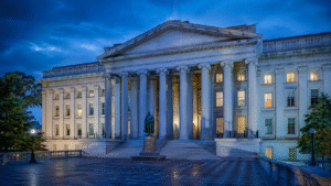 U.S. Treasury building illuminated in blue light during May 2026 bond market volatility
