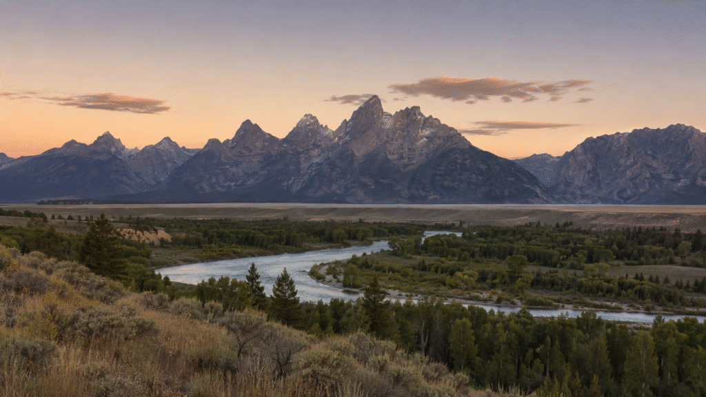 Teton range above the Snake River valley at dawn, where the Jackson Hole 2026 symposium preceded an eleven basis point rise in the 2-year Treasury yield